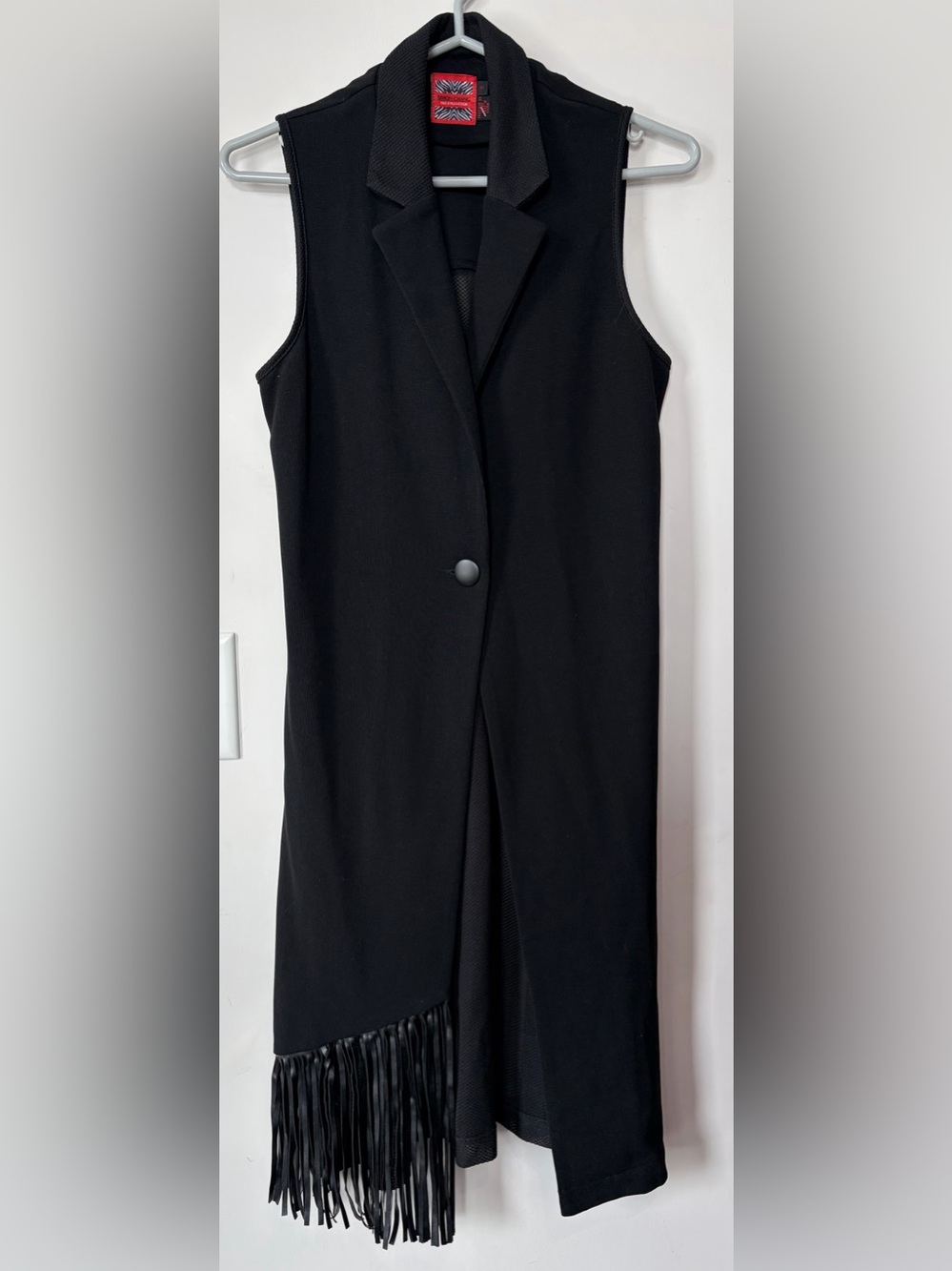 Super cute Simon Chang long fringe vest